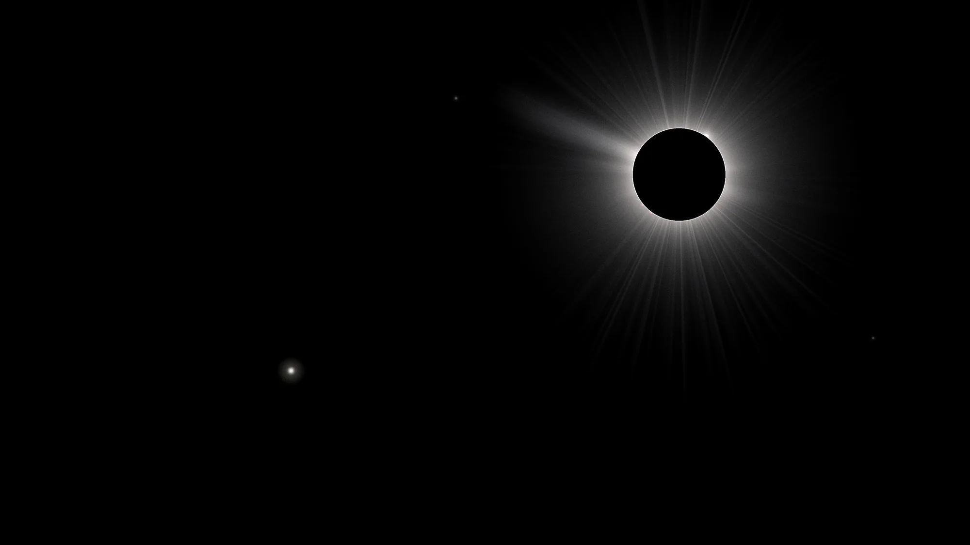 Corona: A total eclipse seen off to the upper right: a black disc ringed by a pearly corona with fine polar plumes and one long streamer trailing off to the left. Venus and two faint stars sit in a true-black sky.
