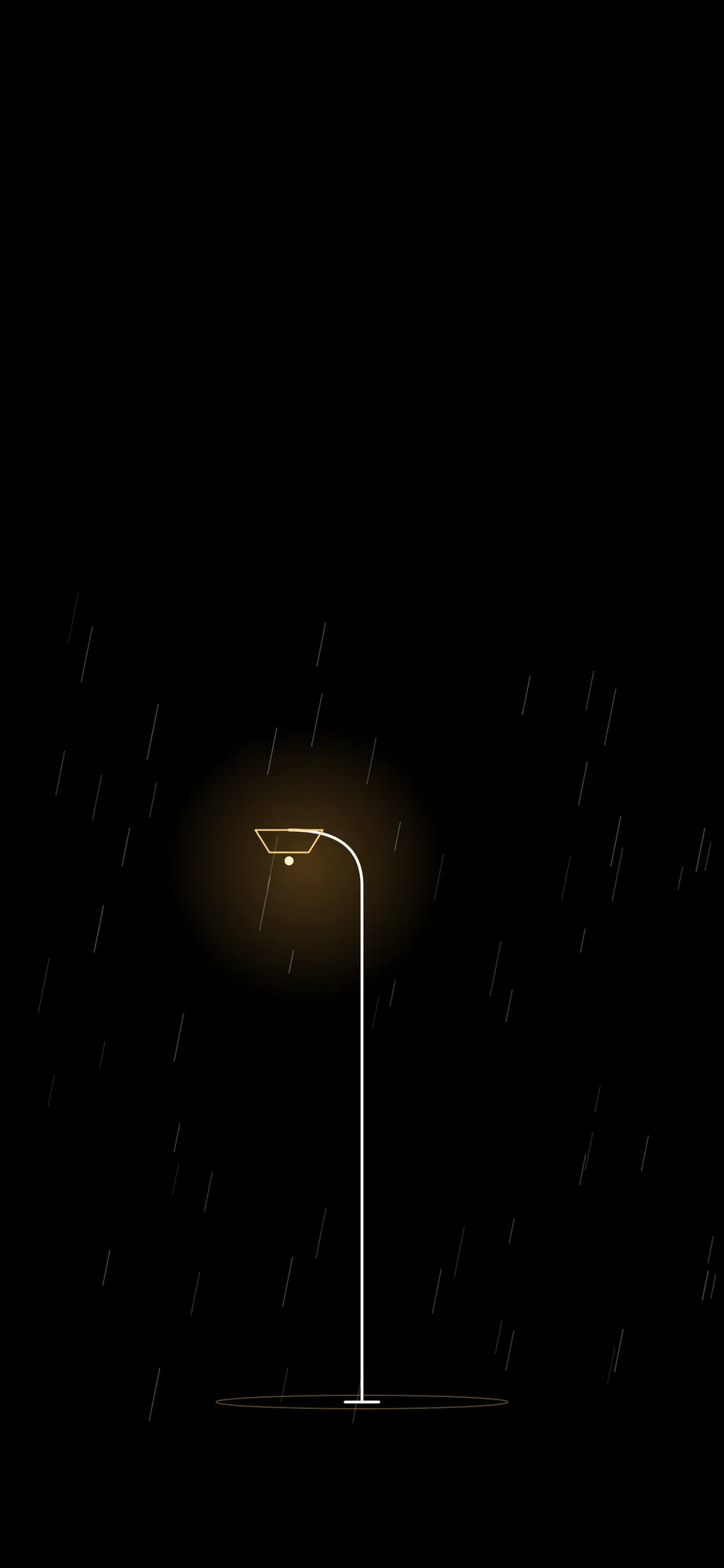 Rainy Streetlamp: Thin rain streaks falling around one warm streetlamp.