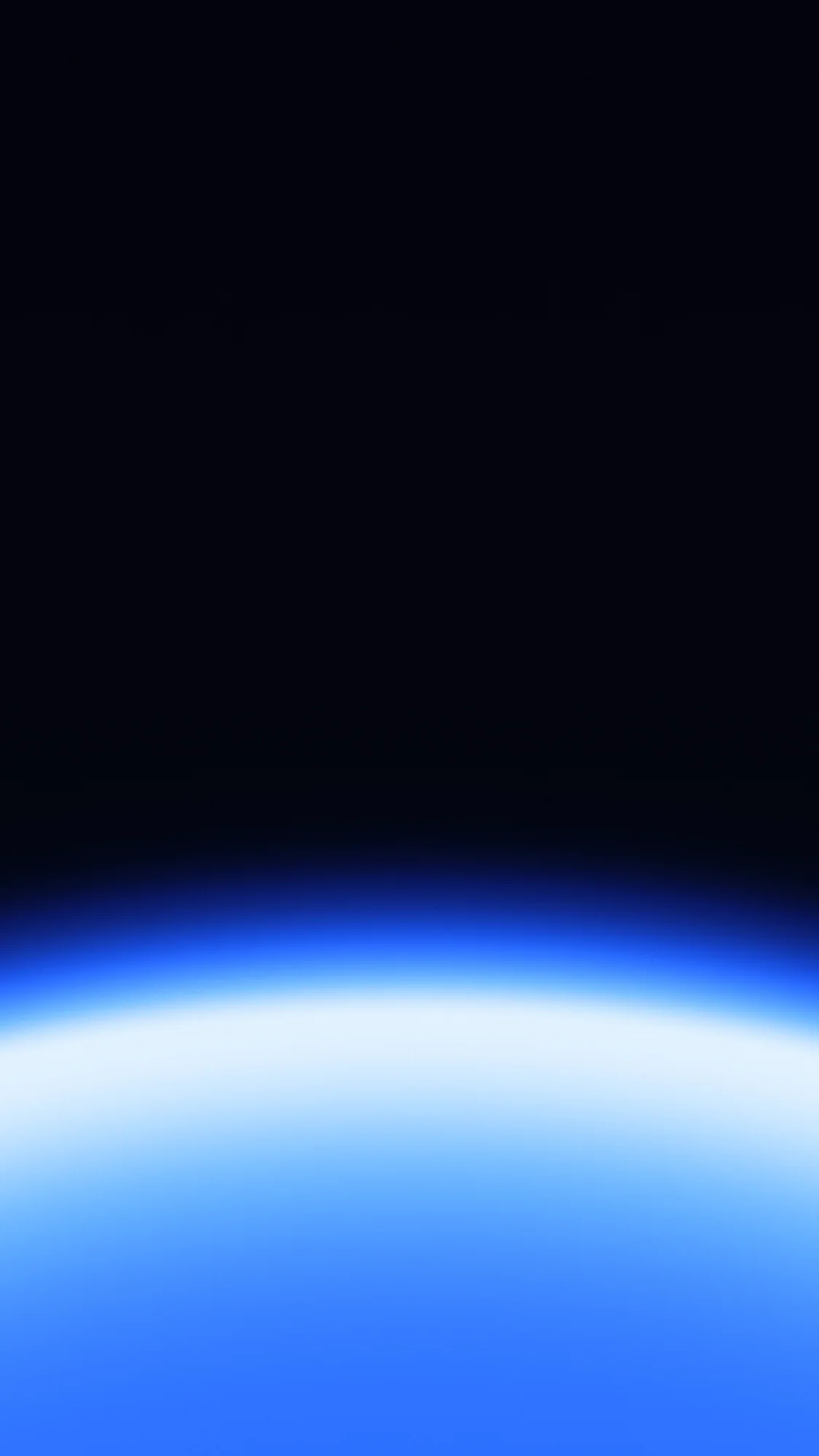 Midnight Horizon: Black-blue night above a thin curved horizon of electric blue light.