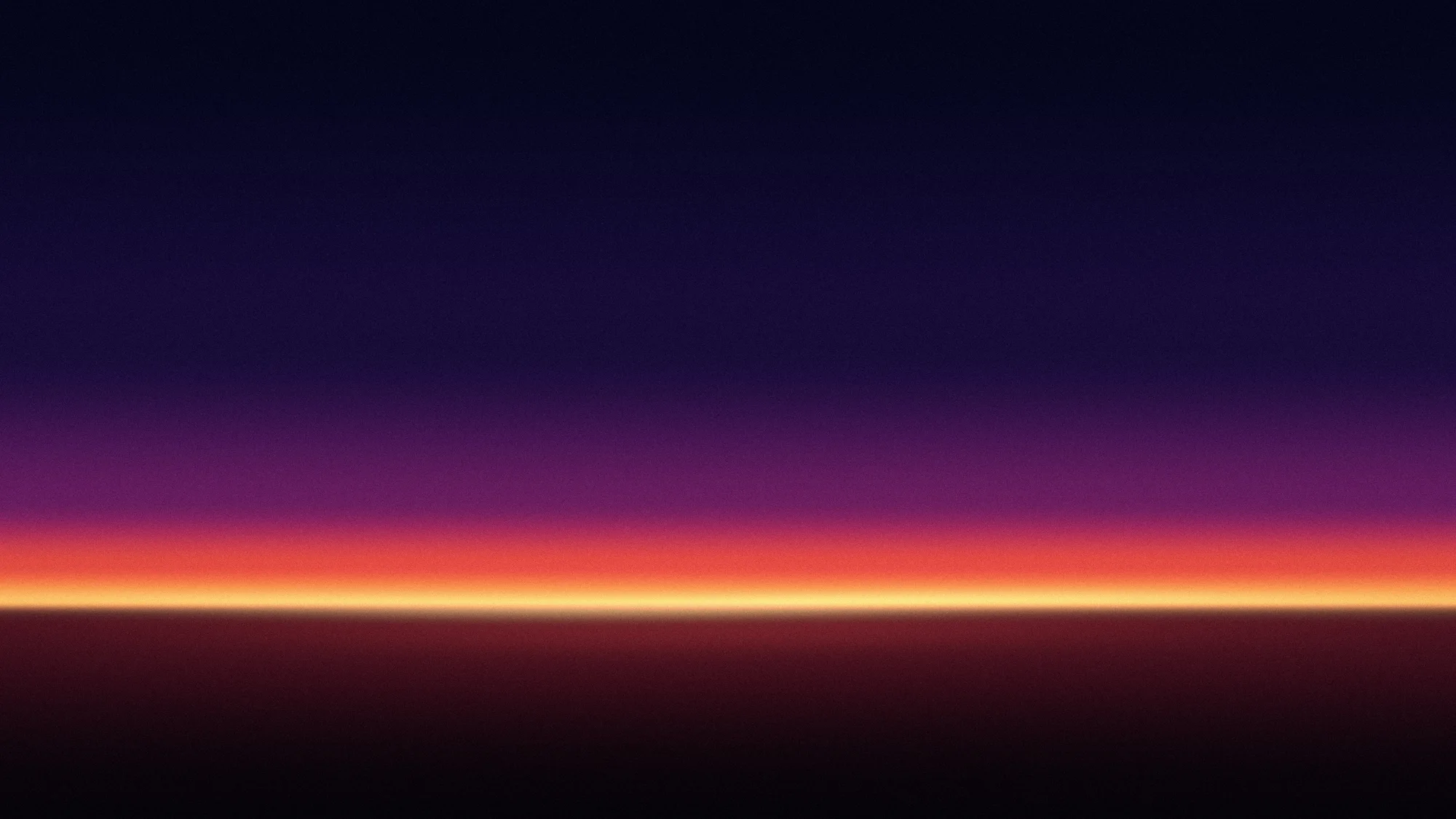 Last Light: A thin line of gold light sits on a dark horizon, with bands of ember red and magenta climbing into an indigo night sky.