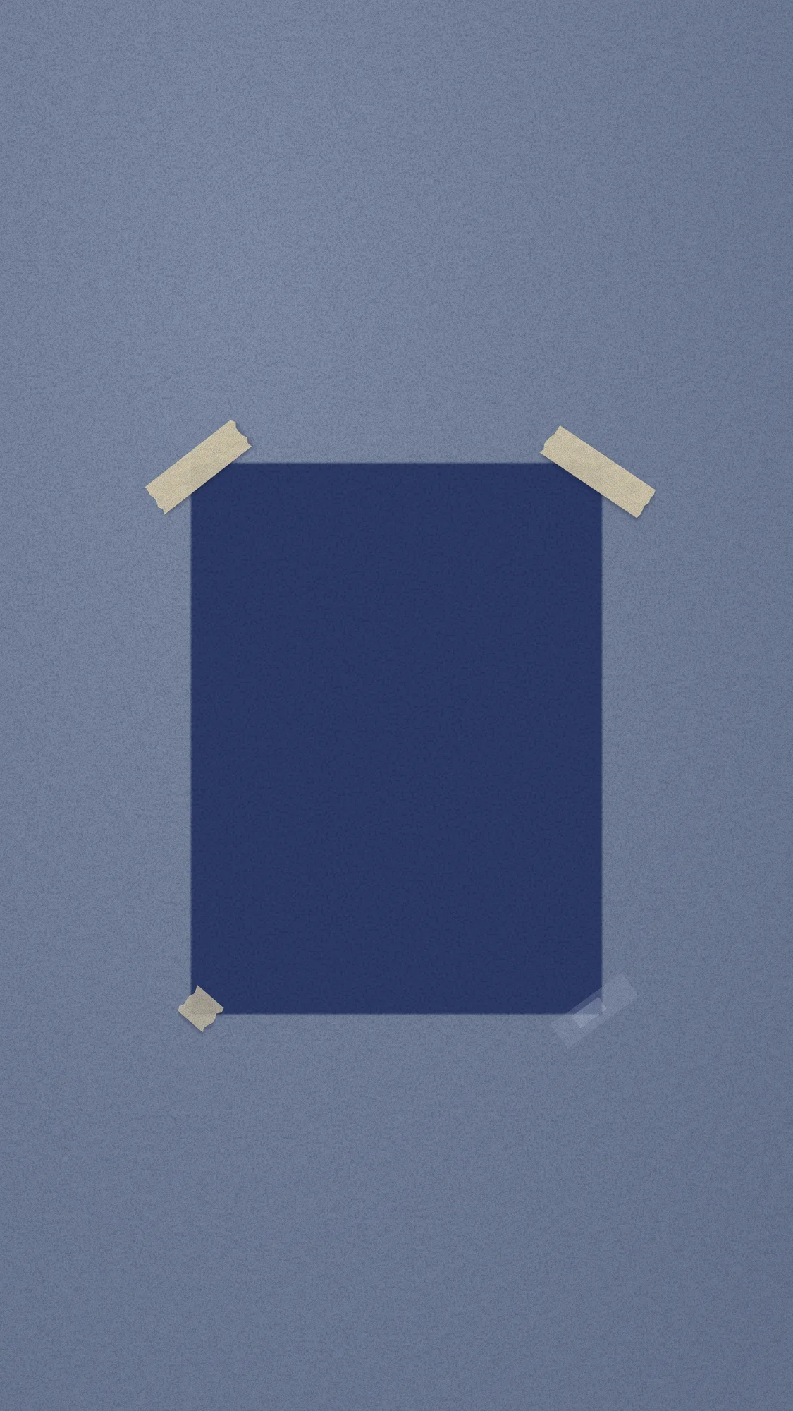 Where the Photo Was: A tall, unfaded navy rectangle on sun-bleached sugar paper marks where a portrait photo used to be, still framed by its leftover masking tape.